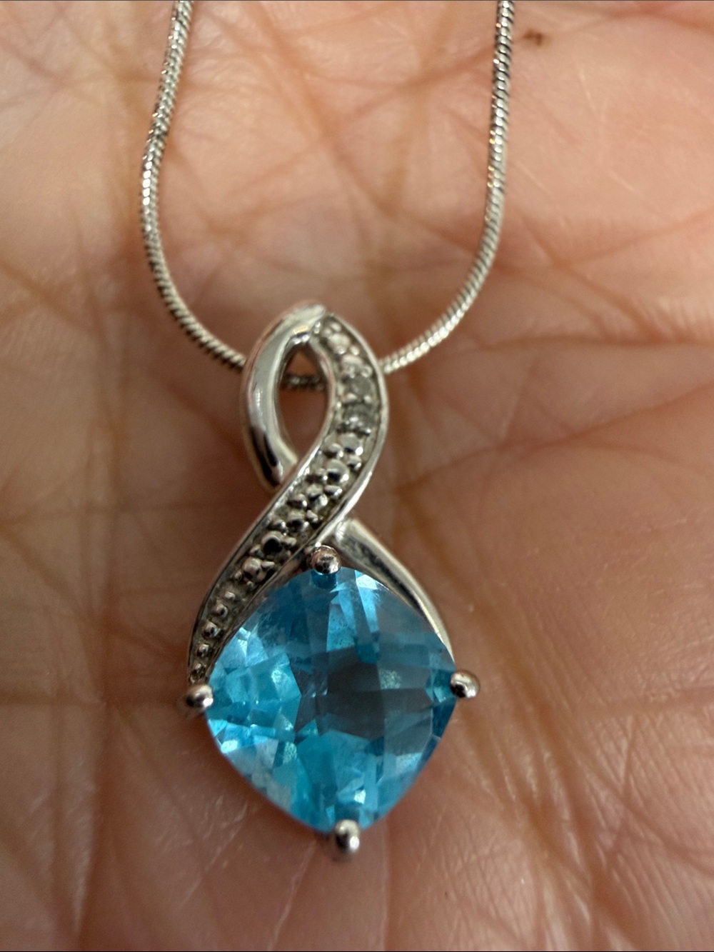 Blue Topaz and tiny diamond chip Sterling SilverPendant - Silver Infinity Design